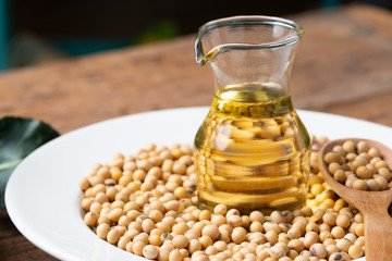 Soy bean and soy oil on  table