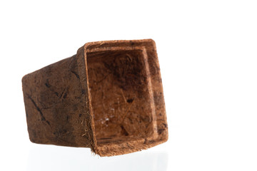 Empty flowerpot made from coconut fiber isolated a on white