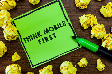 Naklejka premium Text sign showing Think Mobile First. Conceptual photo Easy Handheld Device Accessible Contents 24 or 7 Handy.