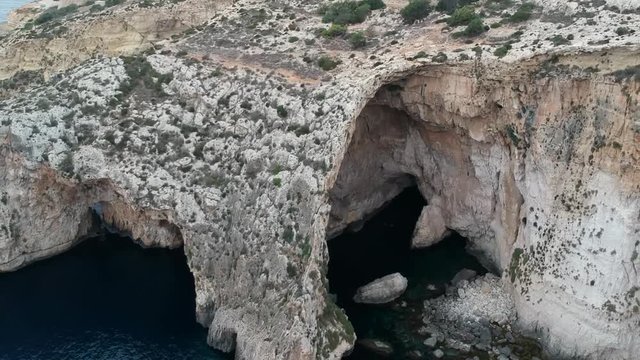 High up in the skies revealing shot of blue groto in Malta