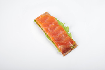 Low caloric open sandwich with salmon. Isolated on white background