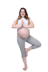 Young pregnant woman doing exercises on white background