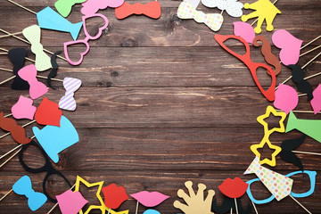 Paper booth props for party on brown wooden table