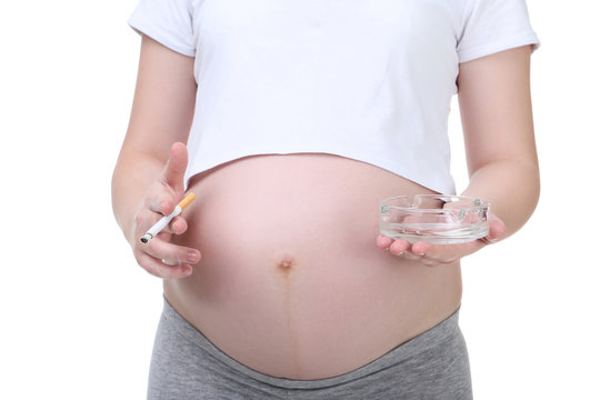Pregnant woman with cigarette on white background