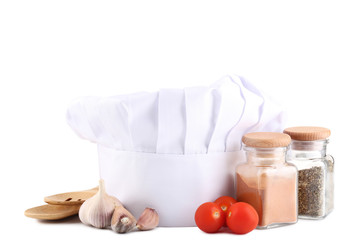 Chef hat with cooking utensils on white background