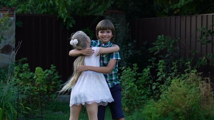 Little girl and boy hugging looking each other childrens emotions and friendship