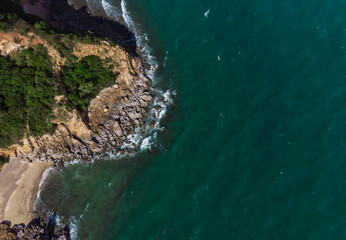 aerial top eye view island rock and criff in the beautiful green sea