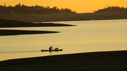 Man and his dog on a Kayak