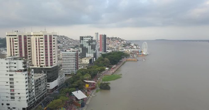 Aerial view of Malecon Simon Bolivar in Guayaquil, a recreational and tourist attraction place with landmarks, ferris wheel and walking space for local people and tourists.