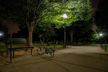 Fototapeta premium Bicycle in public park at night.