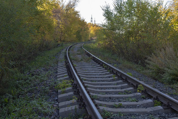 Fototapeta premium Turn of the railway in the autumn
