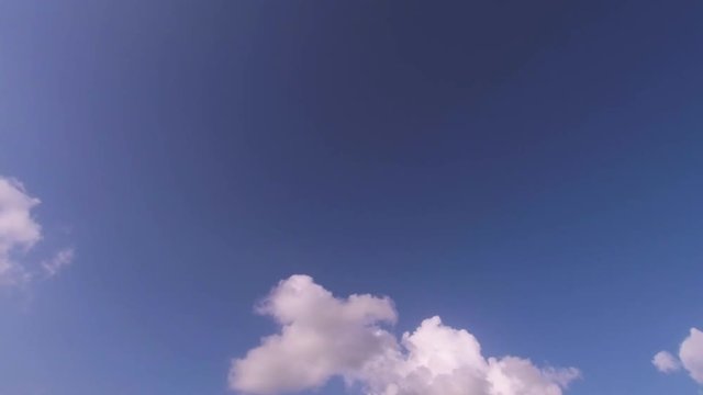 Moving clouds in a blue sky