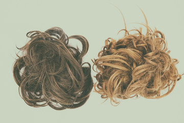 Curly brown and blond hair isolated with vintage effect.