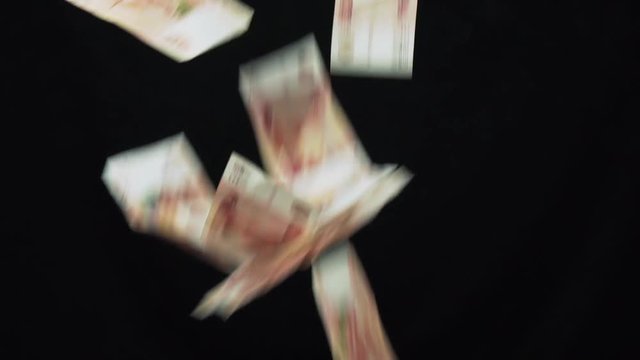 Banknotes five thousand rubles fall on black background slow motion stock footage video