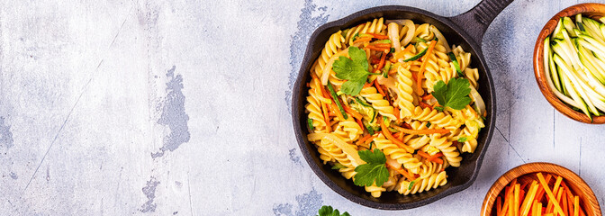 Fusilli pasta with squid, zucchini and carrots