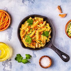 Fusilli pasta with squid, zucchini and carrots