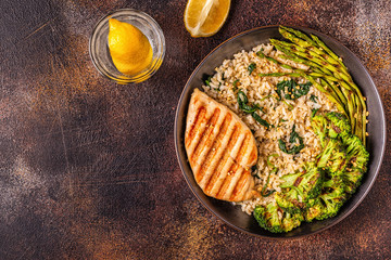 Grilled chicken breast with brown rice, spinach, broccoli, asparagus