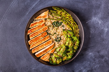 Grilled chicken breast with brown rice, spinach, broccoli, asparagus