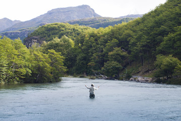Fly fisherman  casting in Ca&ntilde;adon de los Toros River, near Lago del Desierto, Patagonia Argentina