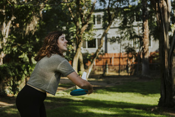 Fototapeta premium Woman playing in a park