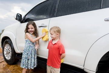 Kids helping to wash the car