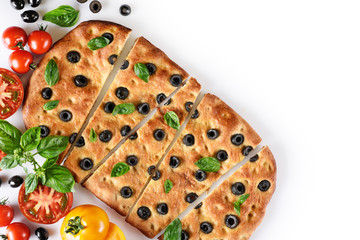 Italian Focaccia with tomatoes, black olives and basil on white background.