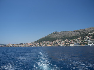 Fototapeta na wymiar View of Dubrovnik old town during a boat tour in a sunny summer day. Dubrovnik, Croatia