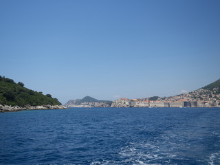 View of Dubrovnik old town and Lokrum island during a boat tour in a sunny summer day. Dubrovnik, Croatia