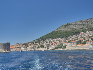 Fototapeta premium View of Dubrovnik old town during a boat tour in a sunny summer day. Dubrovnik, Croatia