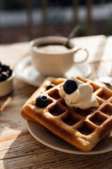 Brussels waffles with blueberry and whipped cream