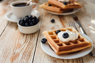 Brussels waffles with blueberry and whipped cream