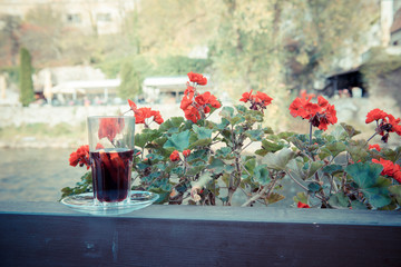 autumn terrace. Wine in a glass. Blooming balcony overlooking the river. The season of autumn and...