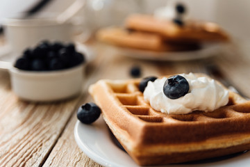 Brussels waffles with blueberry and whipped cream