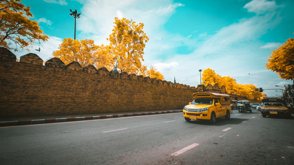 Tuk Tuk and yellow car taxi for traveler in Tha pae Gate Chiang mai Thailand