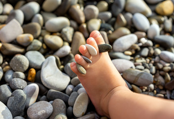 Leg of little child  at sea beach