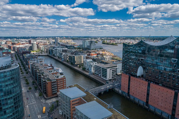 Fototapeta premium Aerial view of amazing port of Hamburg, Germany. Boats, ships and beautiful buildings.