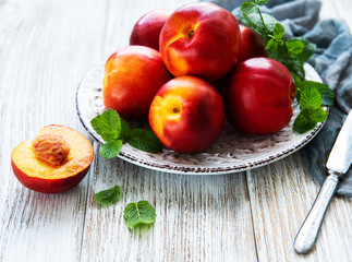 Plate with fresh nectarines