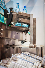 Empty glass bottles on the conveyor. Demonstration of working