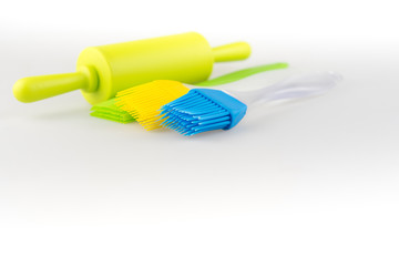 Silicone  brush and rolling bakery and kitchen tools on white background.
