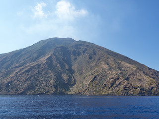 Fototapeta na wymiar View of Stromboli island and volcano from the boat in a summer afternoon