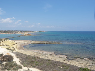View of the coast from the building of Isola delle Correnti in a sunny day