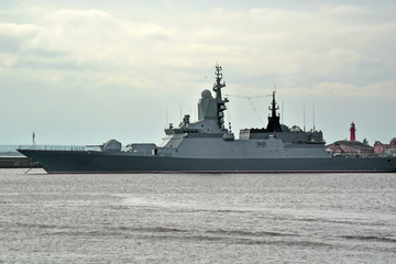 Fototapeta premium Russian modern military missile ship of Corvette class built on stealth technology on the berth in the sea Bay