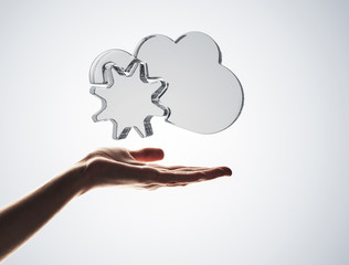 Cloud computing concept with glass symbol shown in hand