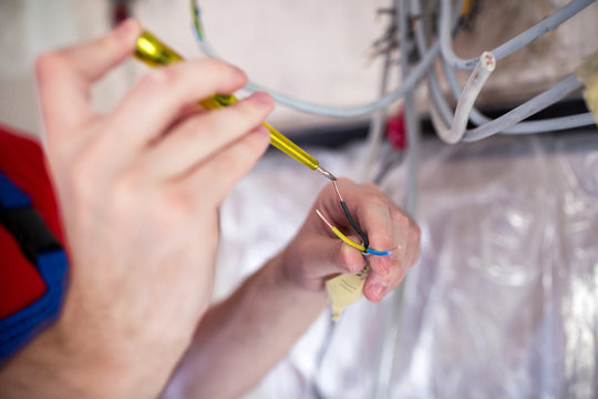 Voltage checking with insulated screwdriver