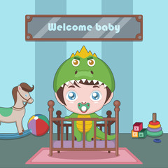 Cute baby in dino costume standing in his crib