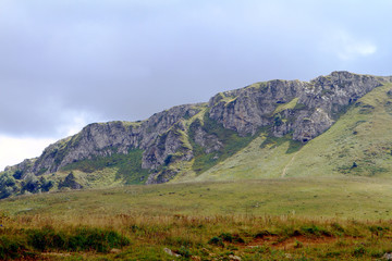 natural landscape photo of northern mountain landscape with heavy grey clouded sky