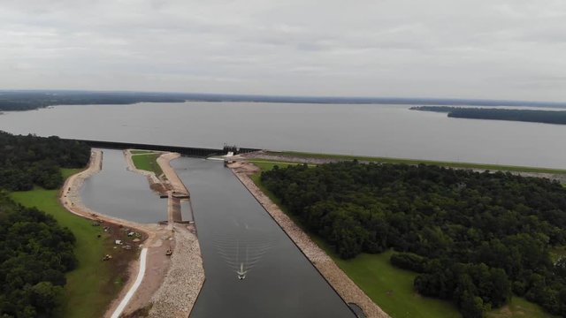Drone aerial footage of Lake Houston, dam, San Jacinto River, and forest