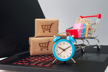 Online shopping / ecommerce and delivery service concept : Paper cartons with a shopping cart or...
