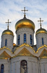 Annunciation church of Moscow Kremlin. Popular landmark. Blue sky background. Color photo.