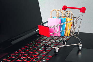 Online shopping / ecommerce and delivery service concept : Paper cartons with a shopping cart or...